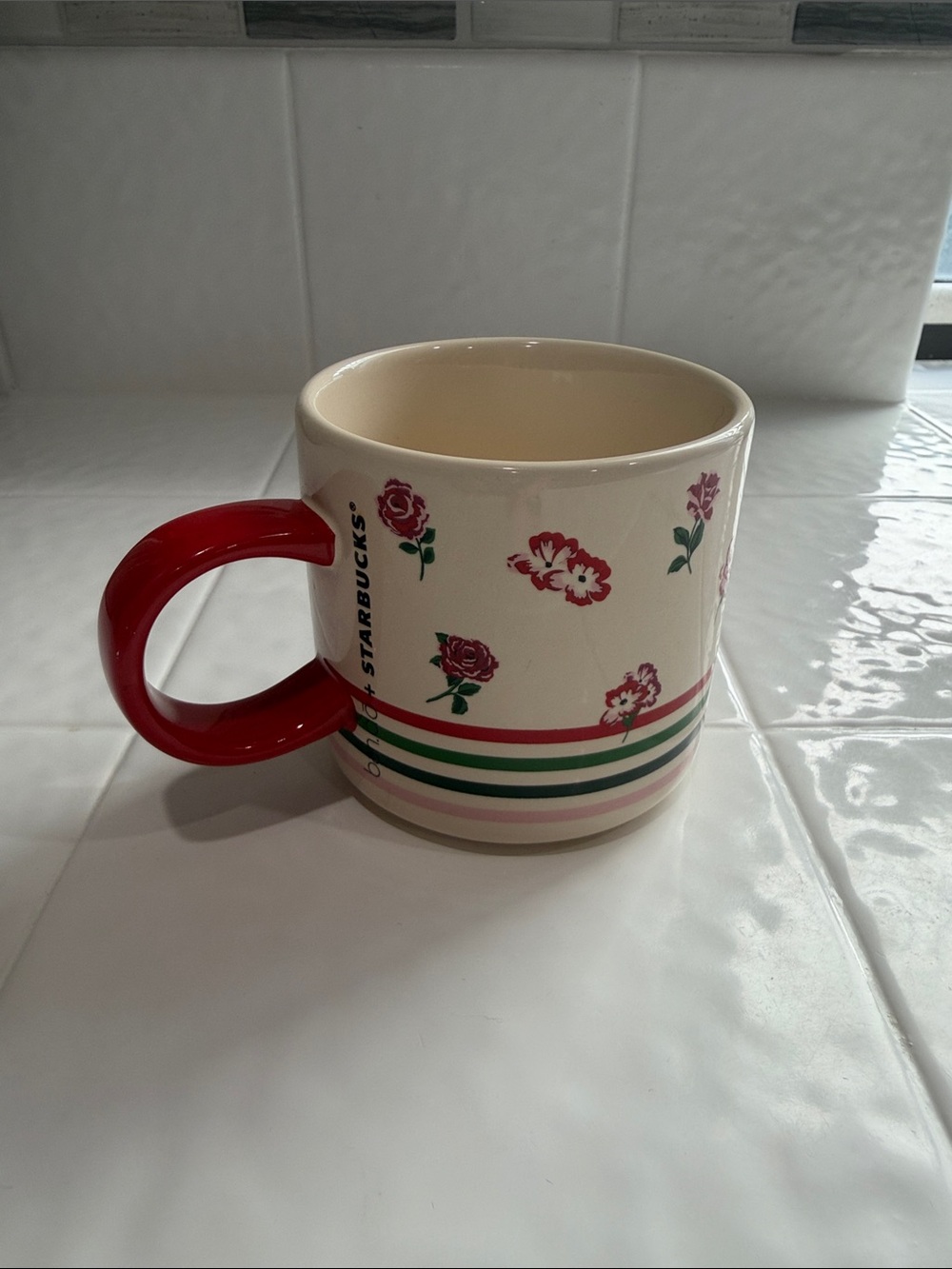 Starbucks Cream Ceramic Mug with Red Handle and Pink Floral Accents